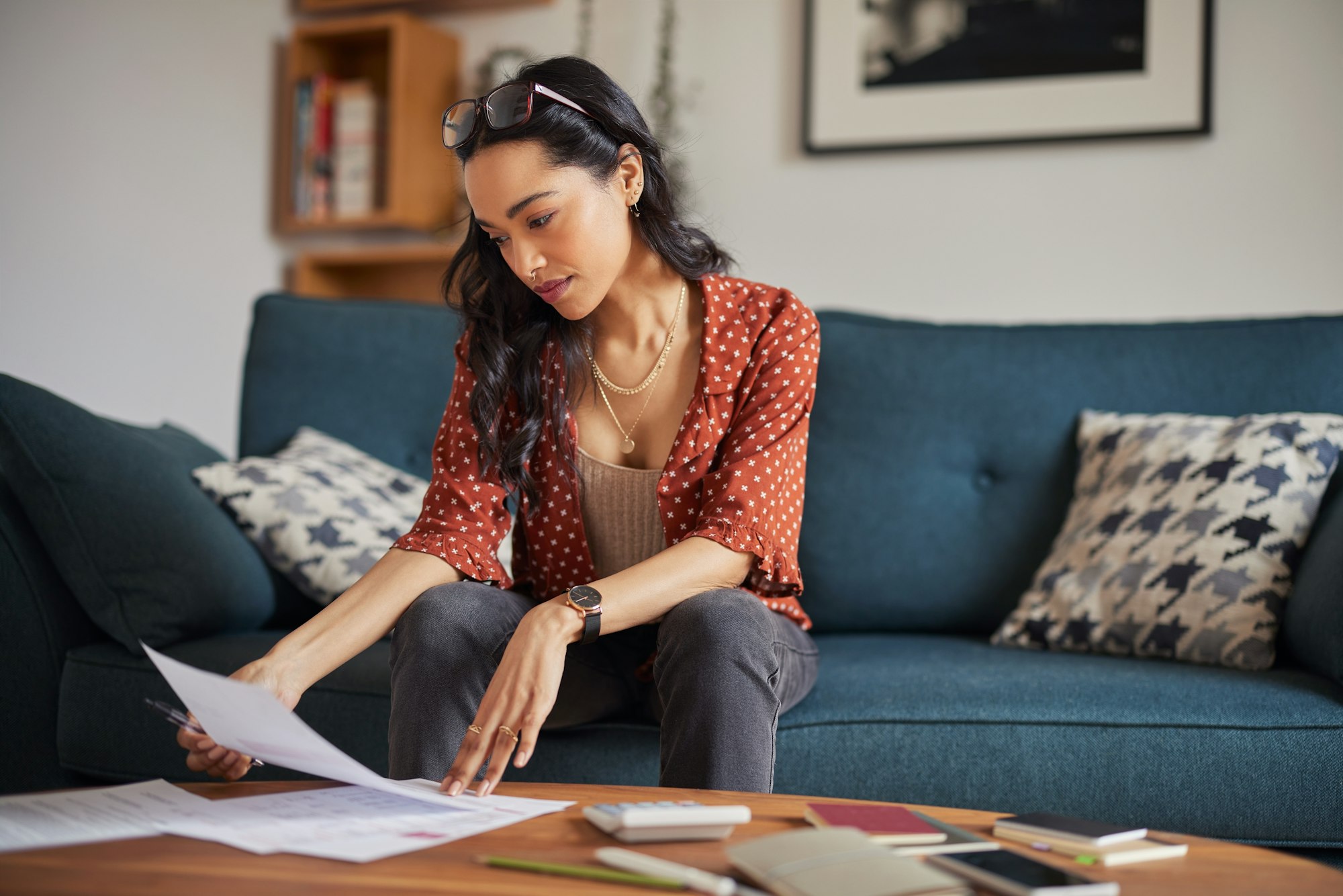 Woman reading bills at home